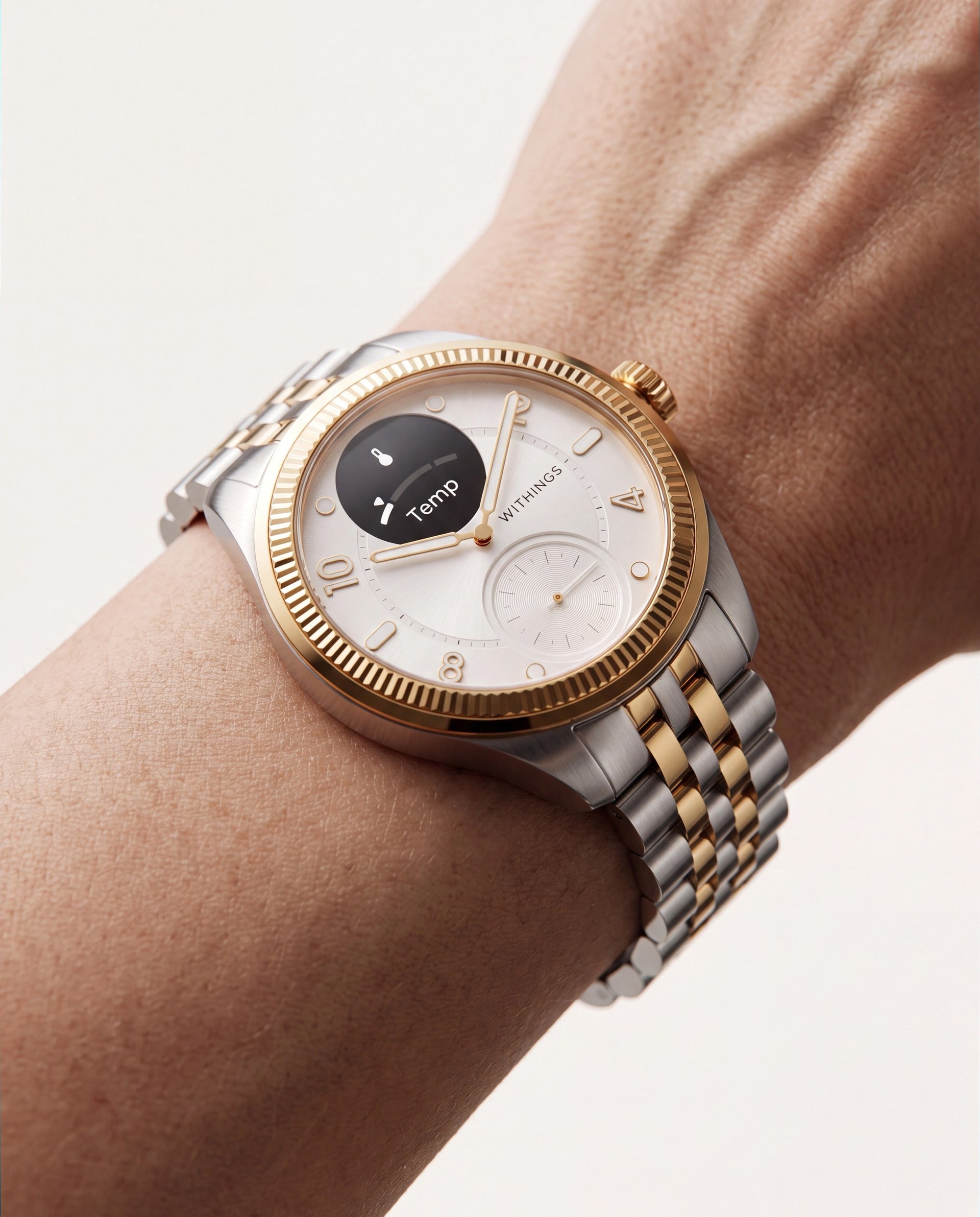 ScanWatch Nova Brilliant — Two-tone Gold/Steel 39mm — Three-quarter wrist view, white dial with active Temp mini-screen, two-tone jubilee bracelet — three-quarter, worn, close-up