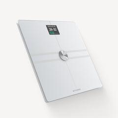 Withings Body Comp — White — Three-quarter view on neutral background, screen displaying Vascular Age 28-32 Optimal — white, three-quarter, lit screen, glass
