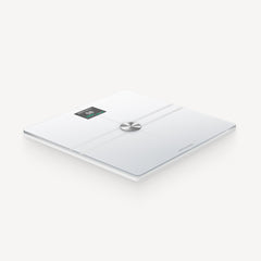 Withings Body Comp — White — Three-quarter perspective view on white background, OLED screen lit, brushed chrome center button — three-quarter, neutral background, white, lit screen