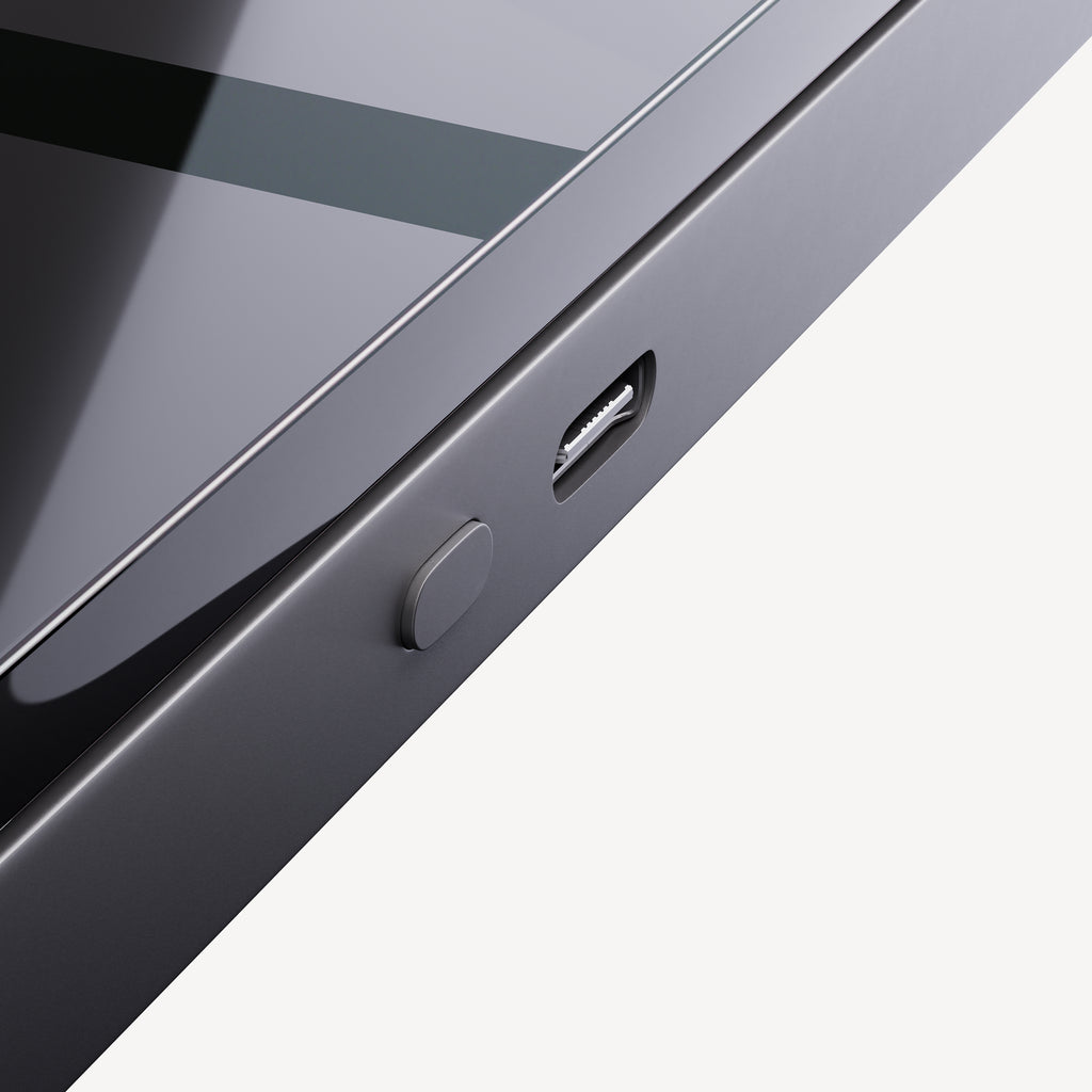 BodyFit — Black — Close-up of the charging port and side button on plain white background, three-quarter angle — close-up, connector, side detail