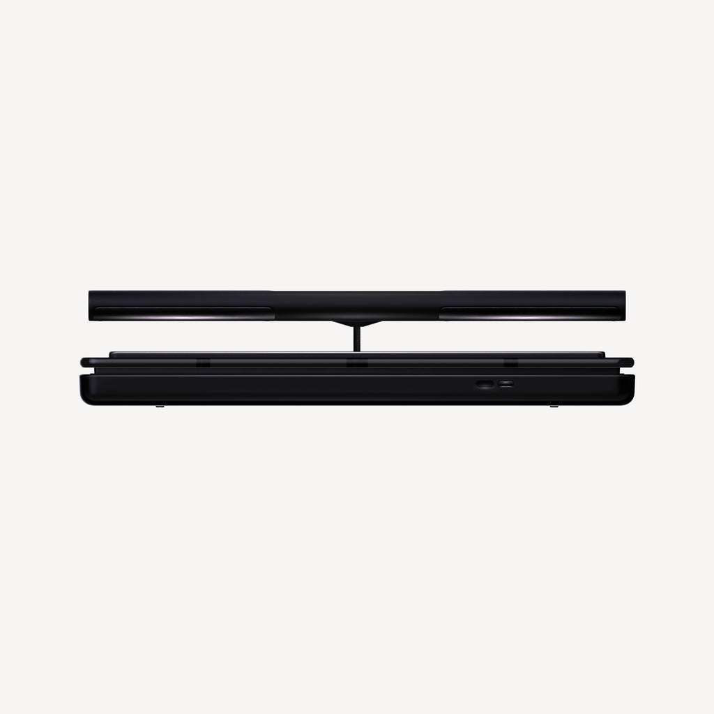 Body Scan 2 — Black — Side profile view, scale folded flat on white background, central hinge visible — side view, black, white background, folded
