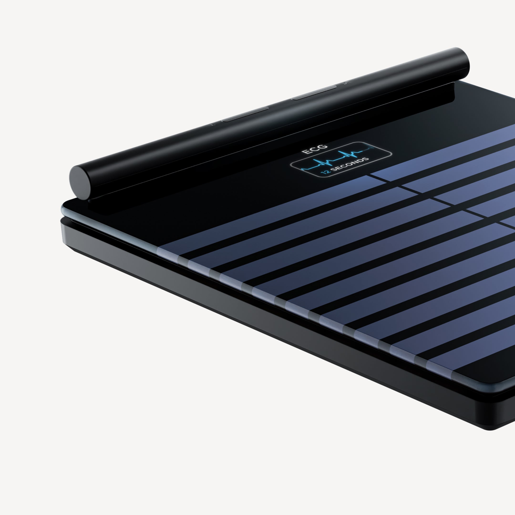 Body Scan — Black — Three-quarter top-down view, black and blue striped surface with illuminated ECG screen, neutral background — close-up, three-quarter, ECG display, dark
