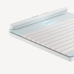 Body Scan — White — Three-quarter angle view of the smart scale with handle roller and electrode surface, neutral background — close-up, three-quarter, white, ECG