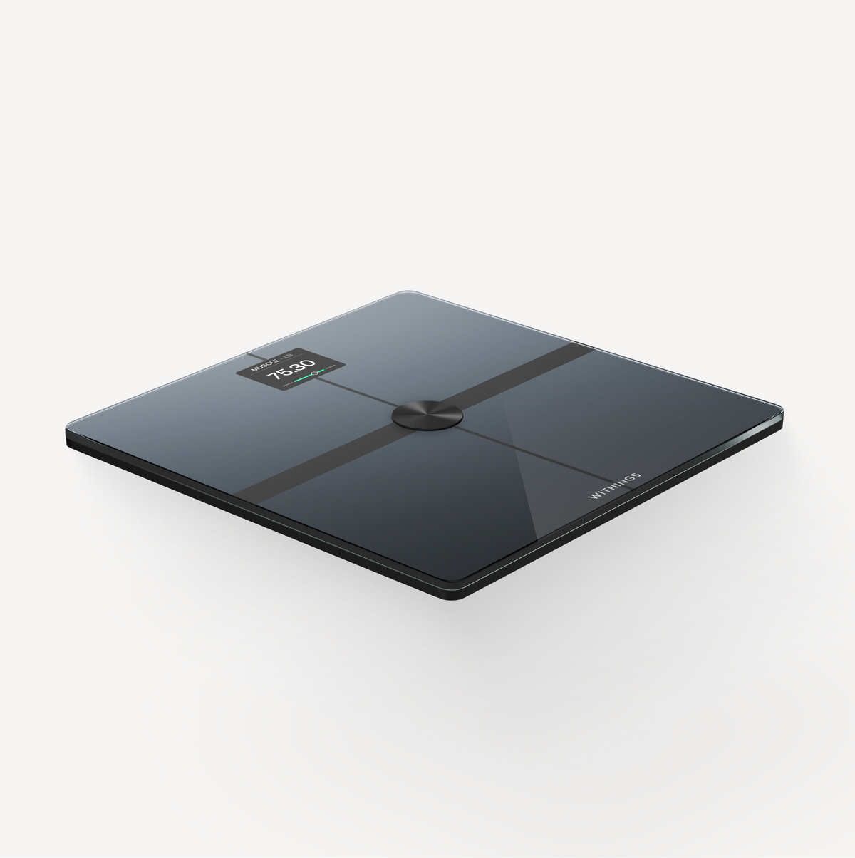 Withings Body Smart — Black — Three-quarter elevated view on light neutral background, LED screen showing 75.30 and muscle metric — black, glass, sleek, three-quarter