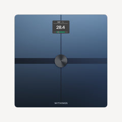 Body Smart — Black — Top-down view on neutral background, screen displaying 28.4% body fat, dark blue surface, metallic center — top-down, black, active screen