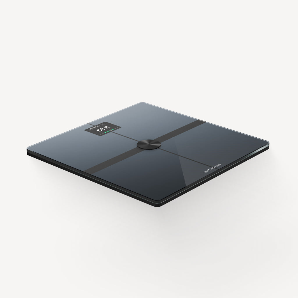 Body Smart — Black — Three-quarter perspective view on white background, glossy black glass surface with LED display, muscle mass and Withings logo — three-quarter, glossy black