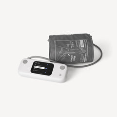BPM Vision — Connected blood pressure monitor — Three-quarter view, white monitor with color screen and extended grey cuff, plain white background — three-quarter, cuff, color screen, neutral background