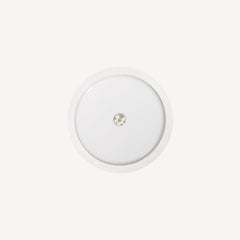 Lingo — Glucose Sensor — Front view on white background, round white biosensor — front, round, white, close-up