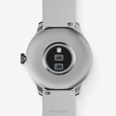 ScanWatch Light — Blanco 37mm — Vista trasera con sensores ópticos y corona sobre fondo liso — parte trasera, sensores, plateado, correa gris