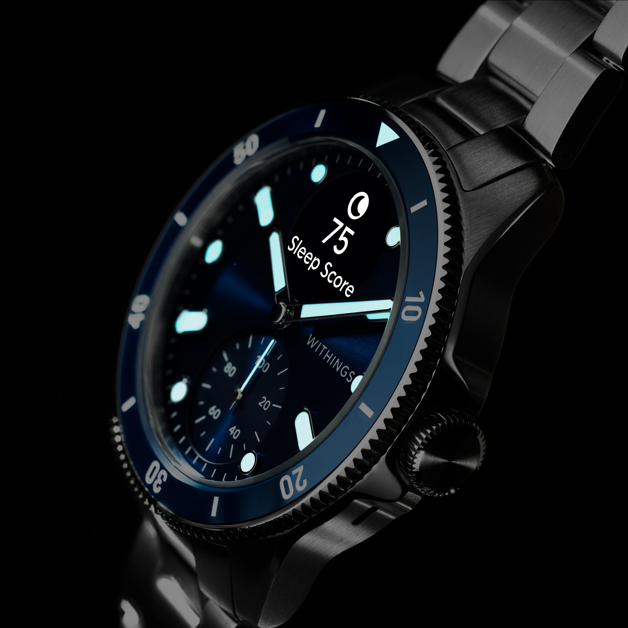 ScanWatch Nova 42mm Blue — Blue variant — Three-quarter view on black background, glowing cyan lume dial, Sleep Score 75 displayed — three-quarter, dark background, lume dial