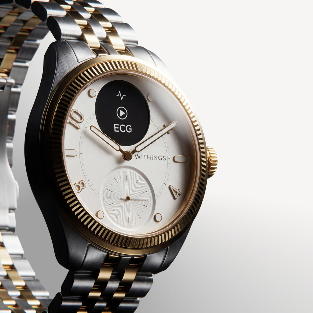 ScanWatch Nova Brilliant — Two-tone gold and steel — Three-quarter view on neutral background, white dial, fluted gold bezel, active ECG screen — three-quarter, two-tone, ECG, jubilee bracelet