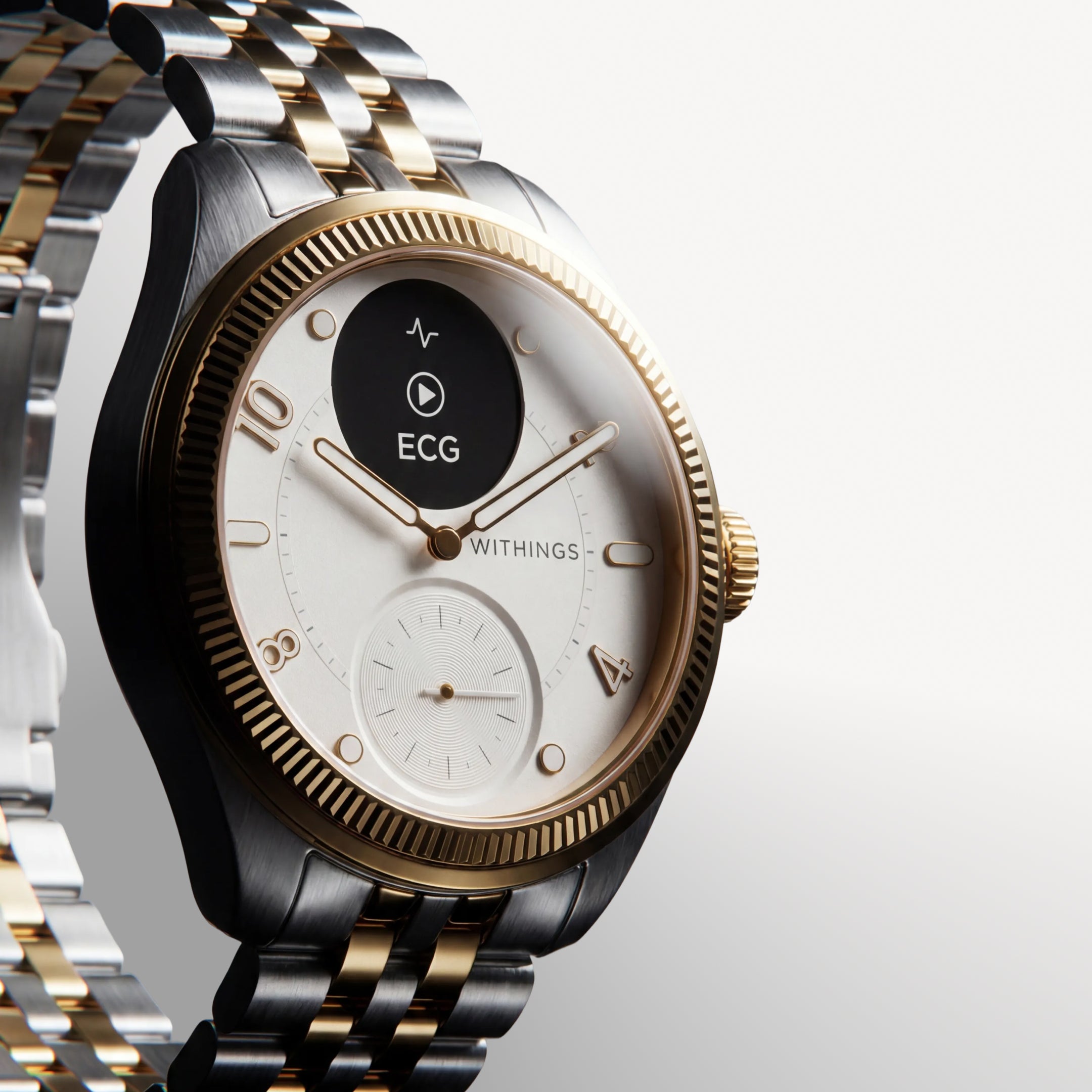 ScanWatch Nova Brilliant — Two-tone gold and steel — Three-quarter view on neutral background, white dial, fluted gold bezel, active ECG screen — three-quarter, two-tone, ECG, jubilee bracelet